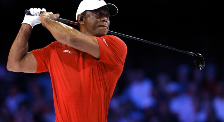 Tiger Woods walking the fairway at Augusta National during the Masters Tournament